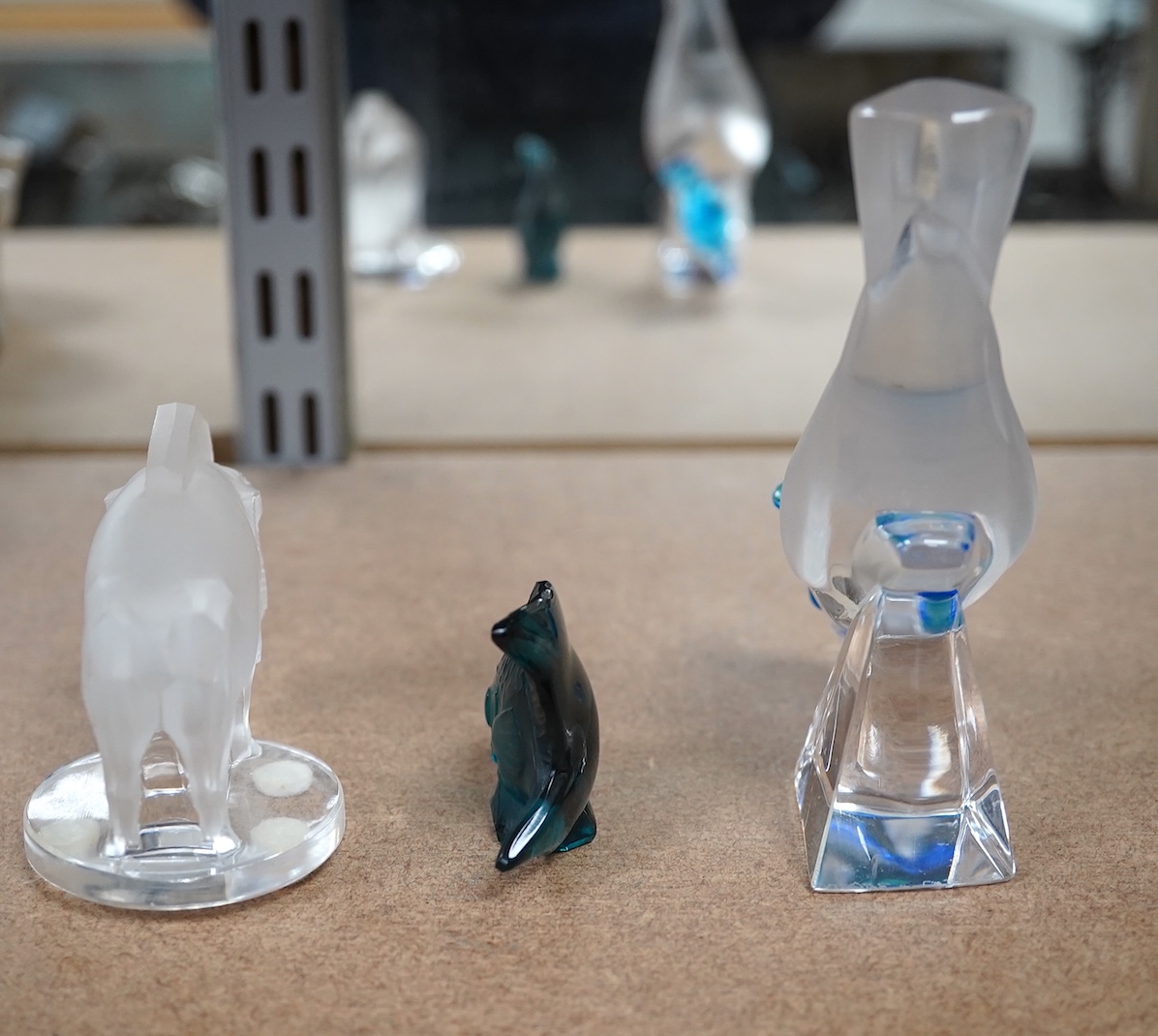 Three pieces of modern Lalique glass in the form of animals, each signed, one with box, 12cm high. Condition - good